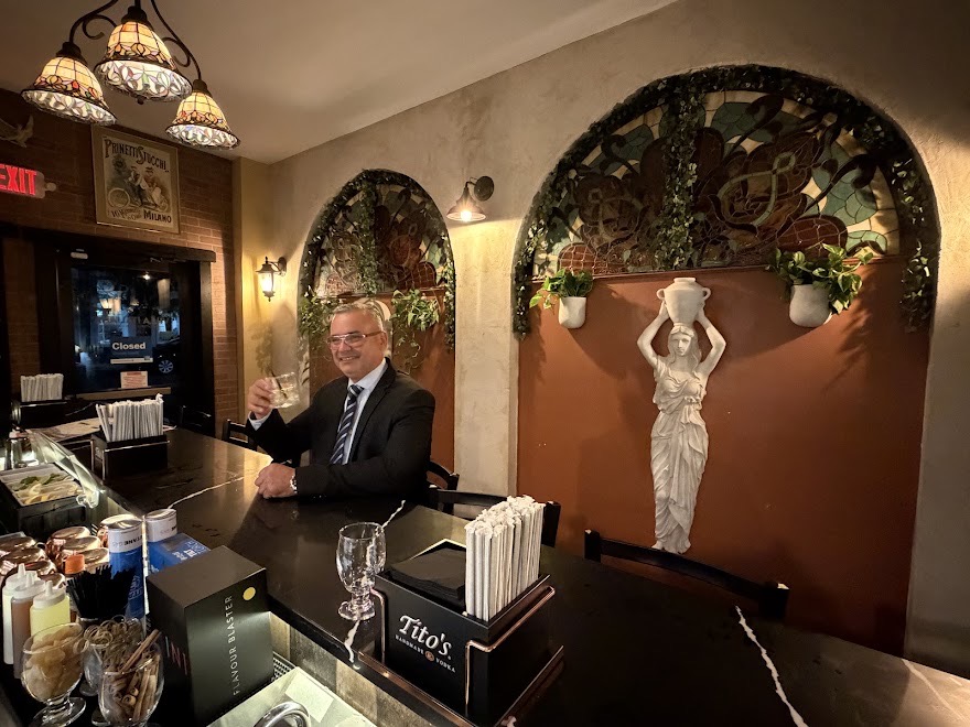 A guest enjoying a drink at Villa Italiana’s bar