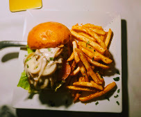 A burger served with fries