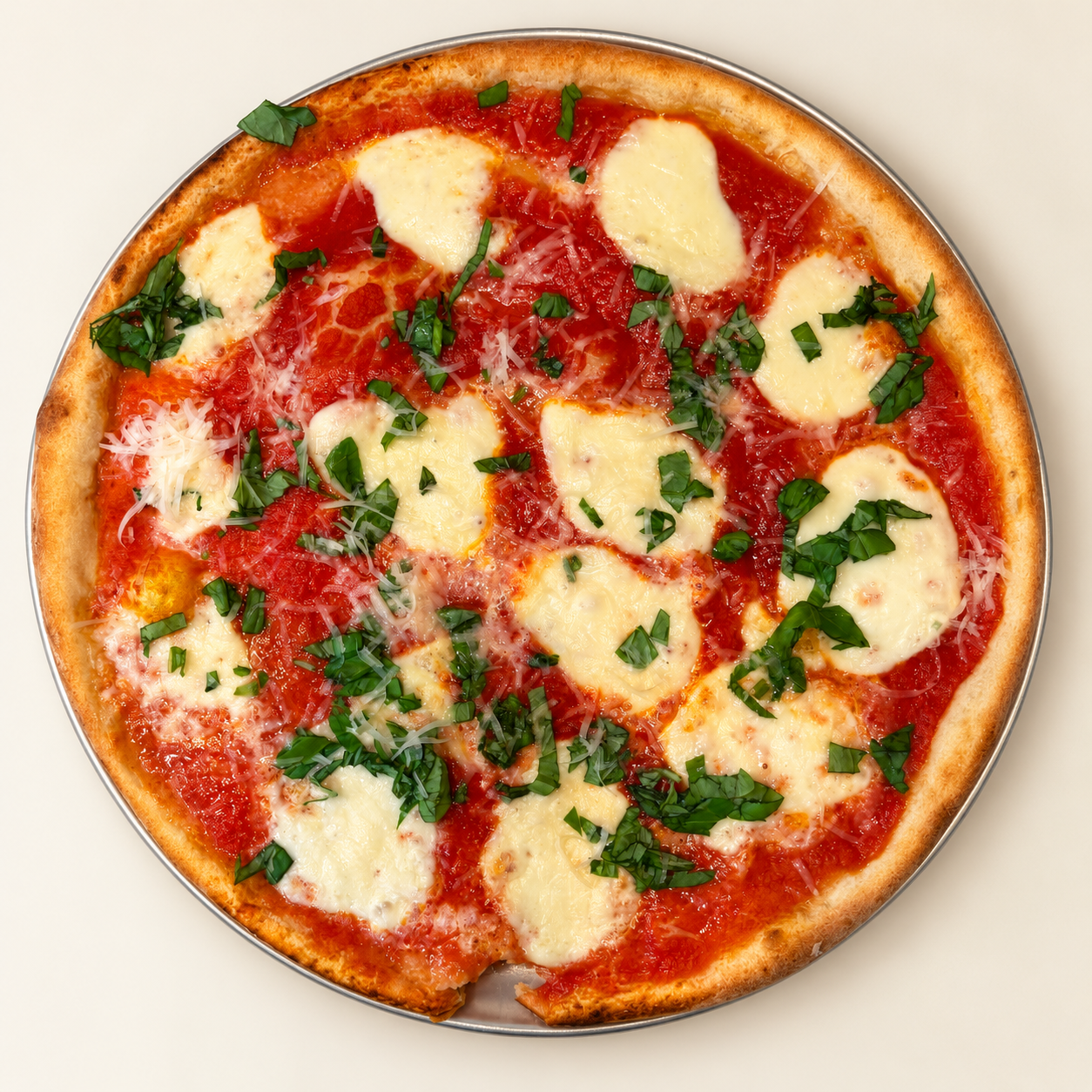Pizza with tomato sauce, mozzarella and basil